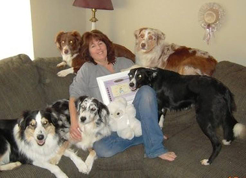 This was taken a few years ago but one of the greatest moments. My son and his wife gave me a picture for christmas - I had NO clue what it was ??? then realized it was announcing they were pg and the potential names of my first grandbaby. Dogs with me are Shasta (behind me) Coda next to her, Jessie far left, Levi under my arm, and rescue Nikki who passed 3 yrs ago ;( I will always remember that day -